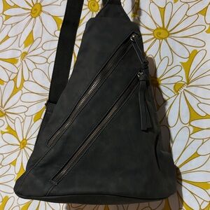 Stylish green sling to backpack bag.